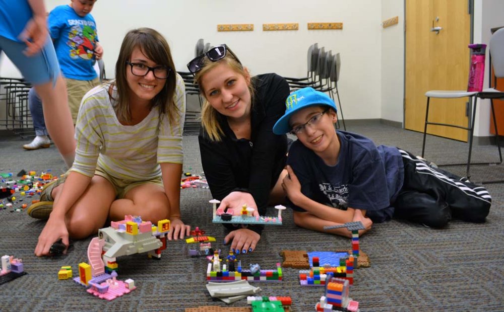 volunteers playing with child